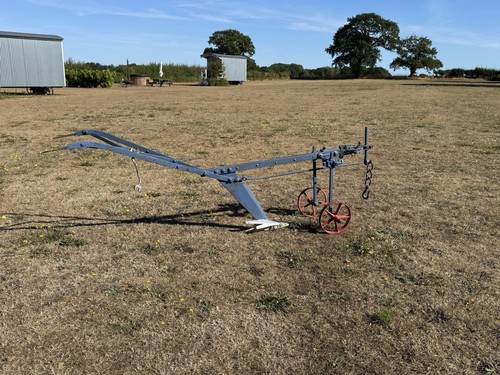 Antique horse drawn plough - drawn,